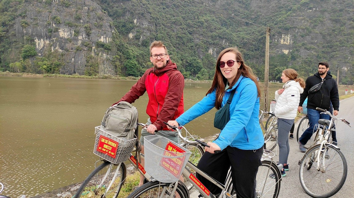 Cycling through the scenic countryside of Ninh Binh with your partner
